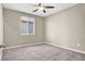Cozy bedroom featuring carpet flooring and a ceiling fan for added comfort at 10976 Bluebell Basin Rd, Las Vegas, NV 89179