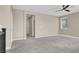 Bright bedroom with carpet flooring, ceiling fan, and natural light from a single window at 10976 Bluebell Basin Rd, Las Vegas, NV 89179