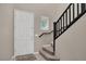Foyer with a white front door, staircase and decorative window at 10976 Bluebell Basin Rd, Las Vegas, NV 89179