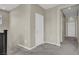Carpeted hallway with white doors, leading to multiple rooms at 10976 Bluebell Basin Rd, Las Vegas, NV 89179