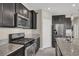 A detailed view of the kitchen with stainless steel appliances and granite countertops at 10976 Bluebell Basin Rd, Las Vegas, NV 89179