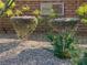 Stone Crest community landscaping featuring bushes and decorative rocks at 10976 Bluebell Basin Rd, Las Vegas, NV 89179