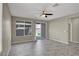 Living Room featuring neutral walls, tile floor, window, and sliding door at 10976 Bluebell Basin Rd, Las Vegas, NV 89179