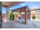Covered patio with brick floor and custom wood pergola at 10976 Bluebell Basin Rd, Las Vegas, NV 89179