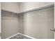 Empty walk-in closet with wood shelving at 10976 Bluebell Basin Rd, Las Vegas, NV 89179