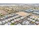 Expansive aerial view of a modern community showcasing diverse housing and a well-planned neighborhood layout at 11228 Burning River St, Las Vegas, NV 89183