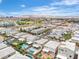 An aerial view of a residential neighborhood featuring pools, landscaped yards, and a clear sky at 11228 Burning River St, Las Vegas, NV 89183