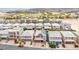 Aerial view of a neighborhood with houses, roofs, and desert landscape in the background at 11228 Burning River St, Las Vegas, NV 89183