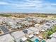 An aerial view of a community showcasing modern homes, green spaces and the beautiful desert landscape at 11228 Burning River St, Las Vegas, NV 89183