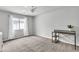 Bedroom boasts natural light, a ceiling fan and neutral colored carpet at 11228 Burning River St, Las Vegas, NV 89183