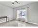 Bright bedroom with neutral walls, large window, and stylish tile flooring at 11228 Burning River St, Las Vegas, NV 89183