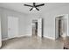 Bright bedroom with a ceiling fan and an ensuite bathroom at 11228 Burning River St, Las Vegas, NV 89183