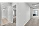 Neutral hallway features a view to the bedrooms and bathrooms at 11228 Burning River St, Las Vegas, NV 89183