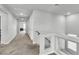 Bright hallway with carpet floors, leading to multiple rooms at 11228 Burning River St, Las Vegas, NV 89183