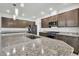 Kitchen island has stainless sink and granite countertops at 11228 Burning River St, Las Vegas, NV 89183