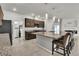 Spacious kitchen with stainless steel appliances, granite countertops, and a breakfast bar at 11228 Burning River St, Las Vegas, NV 89183
