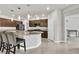 Gourmet kitchen with stainless steel appliances, granite countertops, and eat-in island at 11228 Burning River St, Las Vegas, NV 89183