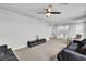 Bright living room boasts neutral decor, sleek media console, and a cozy seating area at 11228 Burning River St, Las Vegas, NV 89183