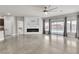 Open living area featuring an electric fireplace and sliding glass doors to a pool at 11228 Burning River St, Las Vegas, NV 89183