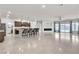 Spacious open floor plan featuring kitchen with island, dining area, and cozy living space at 11228 Burning River St, Las Vegas, NV 89183