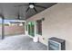 Back patio featuring pavers, a covered ceiling with fans, outdoor lighting, and a barbecue at 11228 Burning River St, Las Vegas, NV 89183