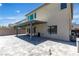 Large covered patio with a ceiling fan and grey paver flooring leading to the backyard pool at 11228 Burning River St, Las Vegas, NV 89183