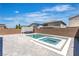 Backyard featuring a modern pool and spa with grey brick pavers in an outdoor living space at 11228 Burning River St, Las Vegas, NV 89183
