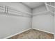 An empty walk-in closet featuring carpet flooring, wire shelving and gray walls at 11228 Burning River St, Las Vegas, NV 89183