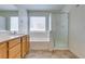 Bathroom with dual sinks, white counter, tub and shower stall at 11668 Tierney Creek Dr, Las Vegas, NV 89183
