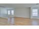 Bright bonus room boasts gleaming wood floors and natural light from staircase windows at 11668 Tierney Creek Dr, Las Vegas, NV 89183