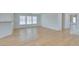 Open living space featuring wood floors and abundant natural light at 11668 Tierney Creek Dr, Las Vegas, NV 89183