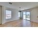 Bonus room featuring bright windows, wood floors, and a sliding glass door at 11668 Tierney Creek Dr, Las Vegas, NV 89183