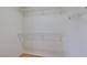 Walk-in closet with white walls, wood floor and wire shelving at 11668 Tierney Creek Dr, Las Vegas, NV 89183