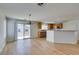 Open-concept dining area with hardwood floors and sliding doors, adjacent to the kitchen at 11668 Tierney Creek Dr, Las Vegas, NV 89183
