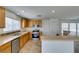 Bright kitchen with stainless appliances, warm wood cabinetry, and a functional breakfast bar at 11668 Tierney Creek Dr, Las Vegas, NV 89183