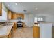 The kitchen features wood cabinets, stainless steel appliances, and tile flooring at 11668 Tierney Creek Dr, Las Vegas, NV 89183