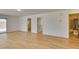 Open-concept living area with hardwood floors and multiple doorways at 11668 Tierney Creek Dr, Las Vegas, NV 89183