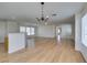 The expansive living area features wood floors, blending seamlessly with a breakfast bar at 11668 Tierney Creek Dr, Las Vegas, NV 89183