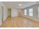 Bright living room with stairs, neutral walls and light wood-look laminate flooring at 11668 Tierney Creek Dr, Las Vegas, NV 89183