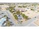An aerial view of a lovely desert home featuring mature trees and a circular driveway at 151 Hornet St, Pahrump, NV 89048