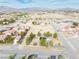 Expansive aerial view of desert home featuring solar panels and mature landscaping at 151 Hornet St, Pahrump, NV 89048