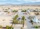 An aerial view of a desert neighborhood featuring mountains and mature desert landscaping at 151 Hornet St, Pahrump, NV 89048