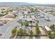 An aerial view of a desert home featuring a circular driveway and mature landscaping at 151 Hornet St, Pahrump, NV 89048
