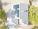 An aerial close up of desert home featuring solar panels and a unique roof at 151 Hornet St, Pahrump, NV 89048