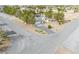 Aerial view of well-maintained home showcasing its desert landscape and convenient circular driveway at 151 Hornet St, Pahrump, NV 89048