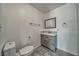 Contemporary bathroom offers a stylish gray vanity and a modern rectangular mirror at 151 Hornet St, Pahrump, NV 89048