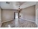 Spacious bedroom features durable laminate flooring and a ceiling fan for optimal comfort at 151 Hornet St, Pahrump, NV 89048