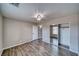 Neutral bedroom with ceiling fan, wood-look floors and sliding closet doors for ample storage at 151 Hornet St, Pahrump, NV 89048
