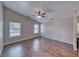 Expansive bedroom with vaulted ceilings, wood-look floors, and dual windows providing natural light at 151 Hornet St, Pahrump, NV 89048