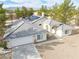 Stunning desert home featuring solar panels, a wide driveway, and lovely desert landscaping at 151 Hornet St, Pahrump, NV 89048